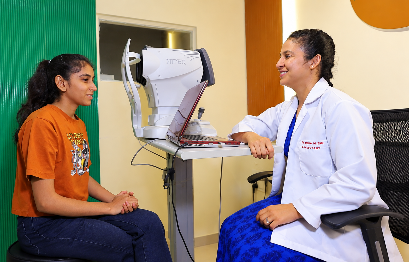 Eye-care professional examining a patient with diagnostic equipment